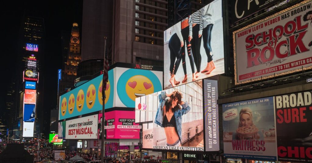 Colorful billboards light up New York City's iconic Times Square at night, with vibrant ads and bustling crowds.